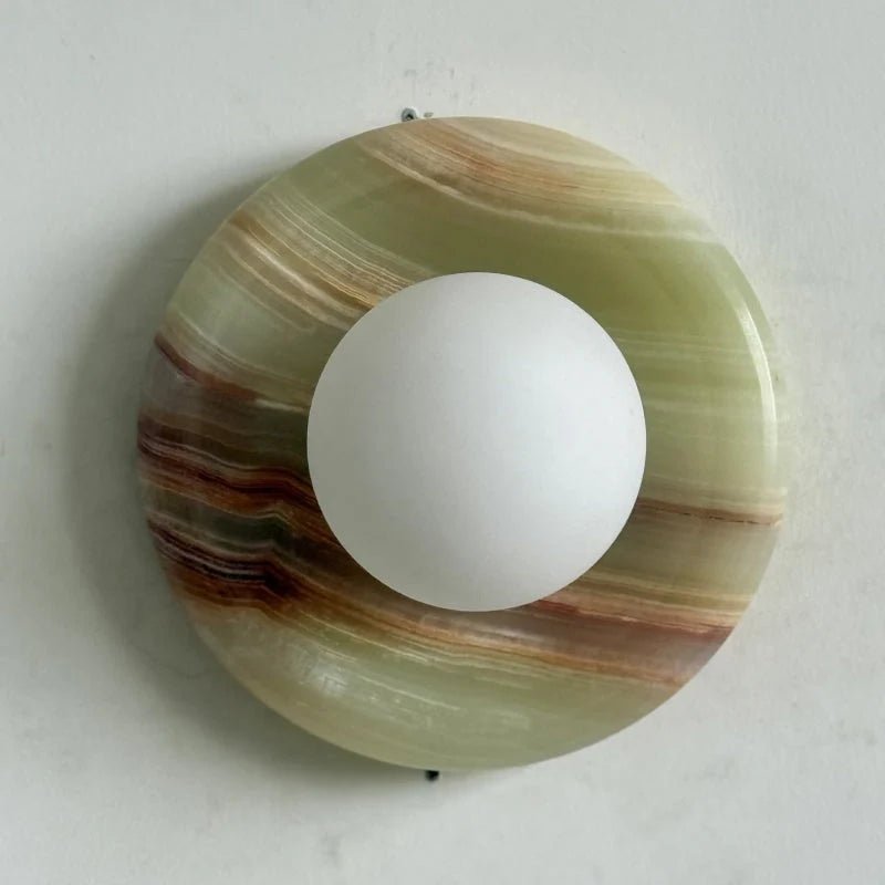 Globe Wall Light featuring a natural onyx backplate, designed as a compact ambient sconce for modern interior decor. 3