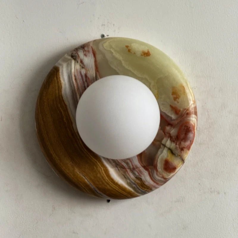 Globe Wall Light featuring a natural onyx backplate, designed as a compact ambient sconce for modern interior decor. 32