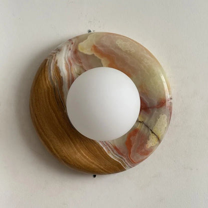 Globe Wall Light featuring a natural onyx backplate, designed as a compact ambient sconce for modern interior decor. 29