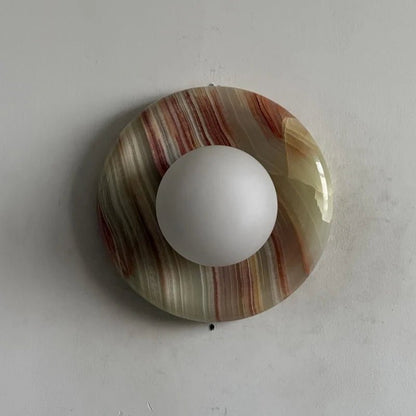 Globe Wall Light featuring a natural onyx backplate, designed as a compact ambient sconce for modern interior decor. 0