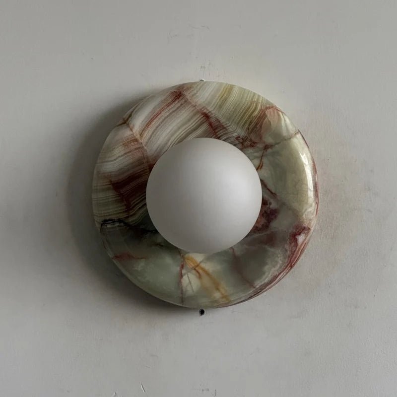 Globe Wall Light featuring a natural onyx backplate, designed as a compact ambient sconce for modern interior decor. 31