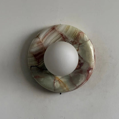 Globe Wall Light featuring a natural onyx backplate, designed as a compact ambient sconce for modern interior decor. 31