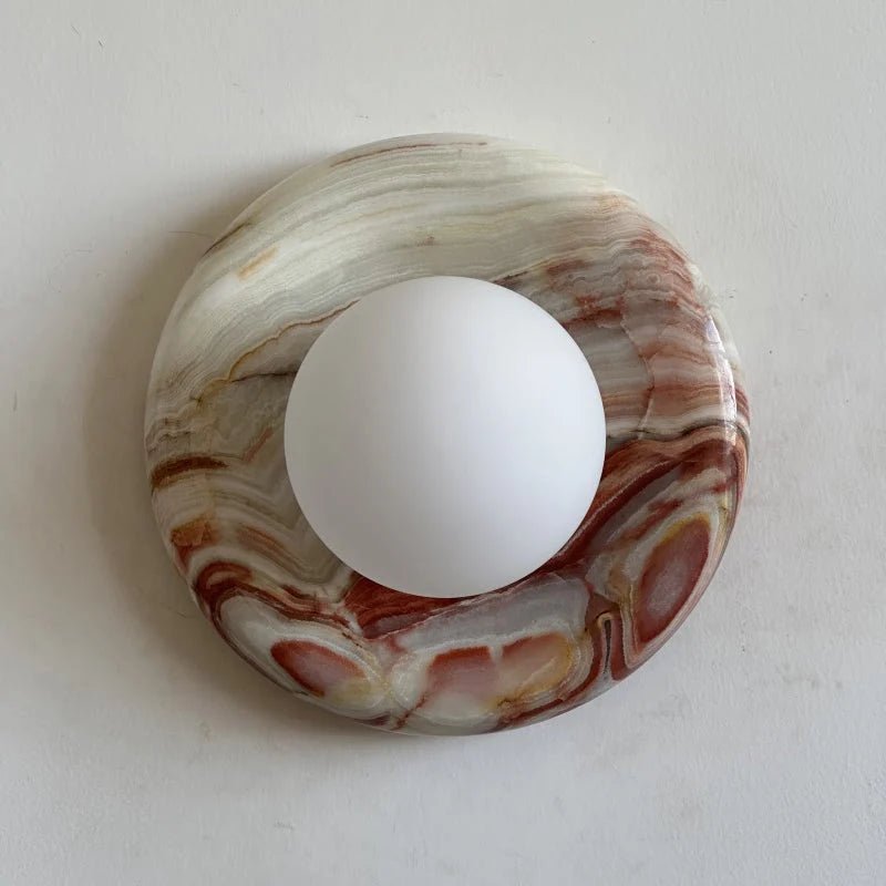 Globe Wall Light featuring a natural onyx backplate, designed as a compact ambient sconce for modern interior decor. 12