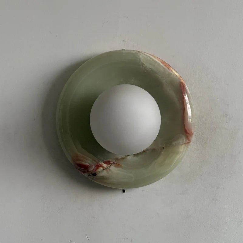 Globe Wall Light featuring a natural onyx backplate, designed as a compact ambient sconce for modern interior decor. 19