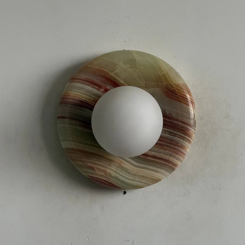 Globe Wall Light featuring a natural onyx backplate, designed as a compact ambient sconce for modern interior decor. 11