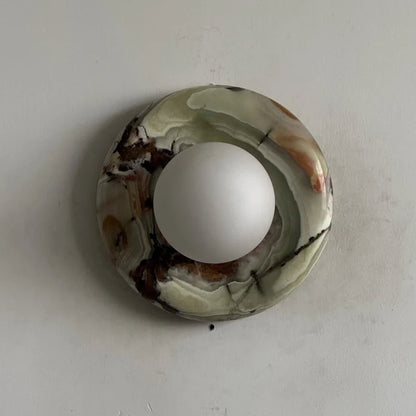 Globe Wall Light featuring a natural onyx backplate, designed as a compact ambient sconce for modern interior decor. 17
