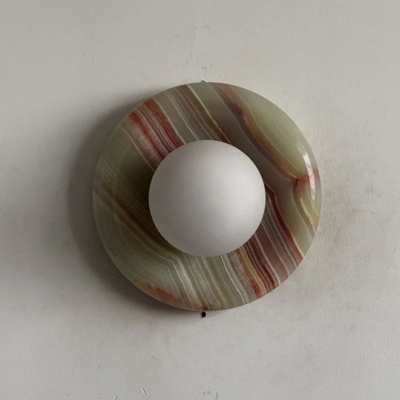 Globe Wall Light featuring a natural onyx backplate, designed as a compact ambient sconce for modern interior decor. 15
