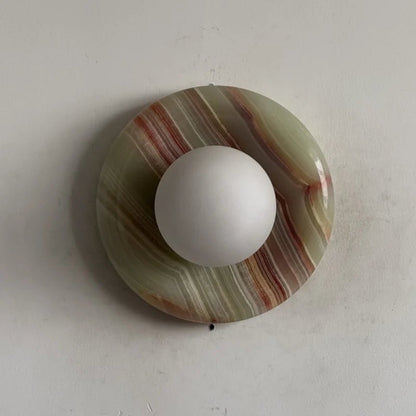 Globe Wall Light featuring a natural onyx backplate, designed as a compact ambient sconce for modern interior decor. 15