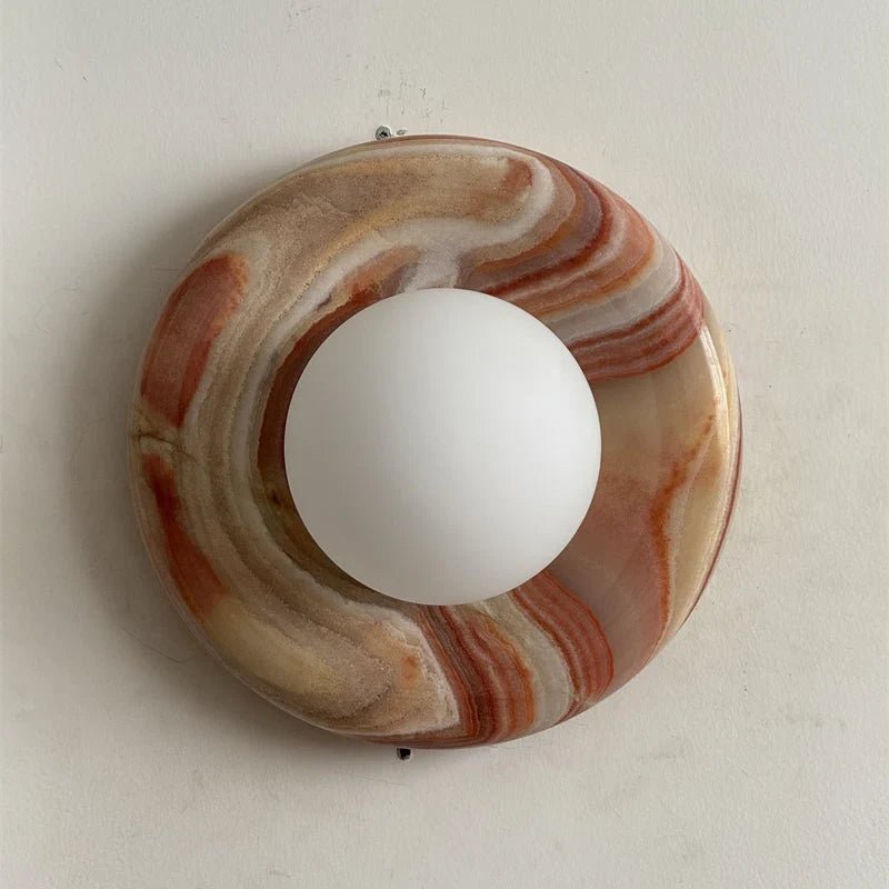 Globe Wall Light featuring a natural onyx backplate, designed as a compact ambient sconce for modern interior decor. 26