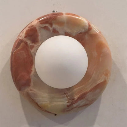 Globe Wall Light featuring a natural onyx backplate, designed as a compact ambient sconce for modern interior decor. 14