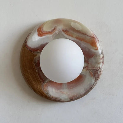 Globe Wall Light featuring a natural onyx backplate, designed as a compact ambient sconce for modern interior decor. 8