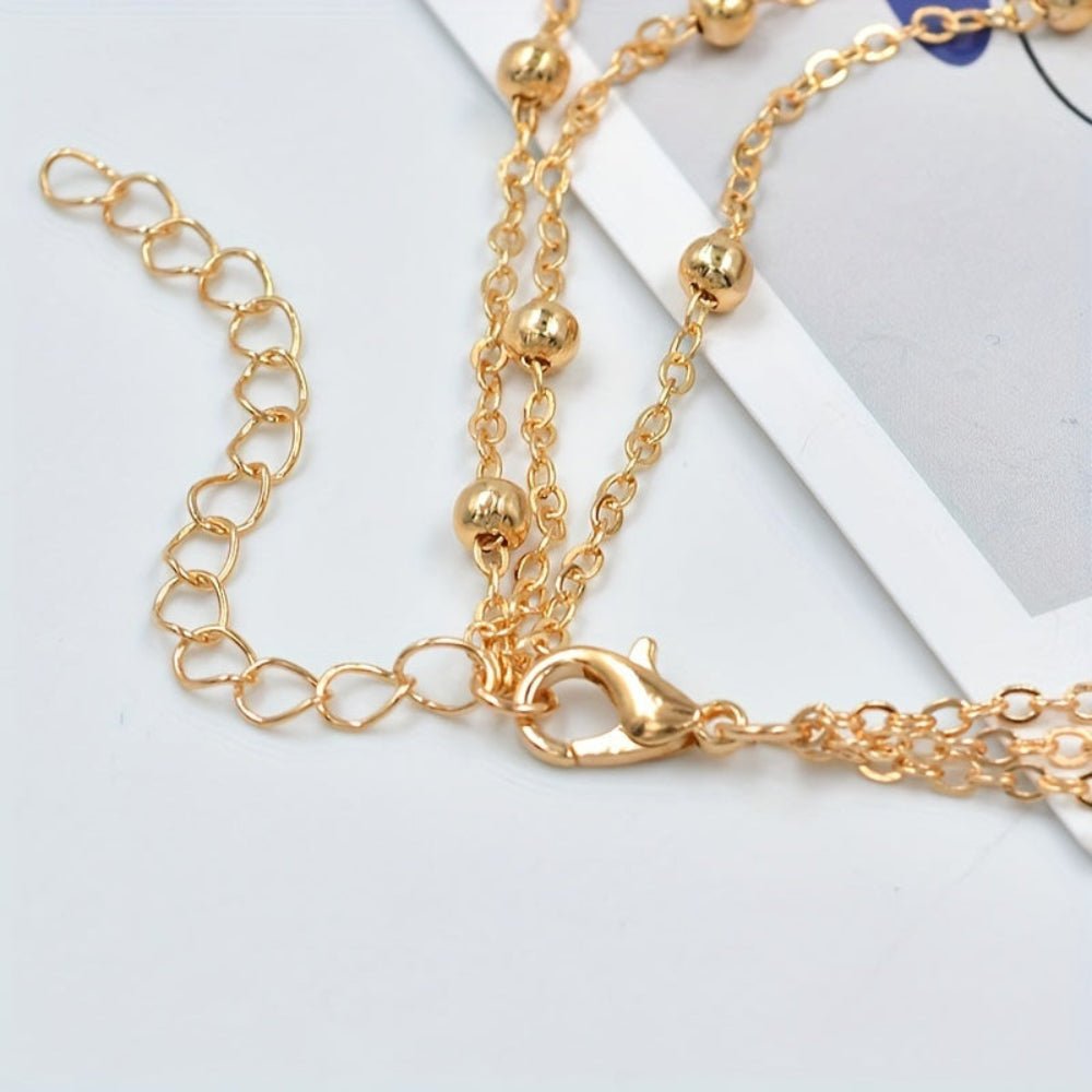 Gold anklet featuring an elegant chain design, perfect for women seeking barefoot foot jewelry for parties and weddings. 1