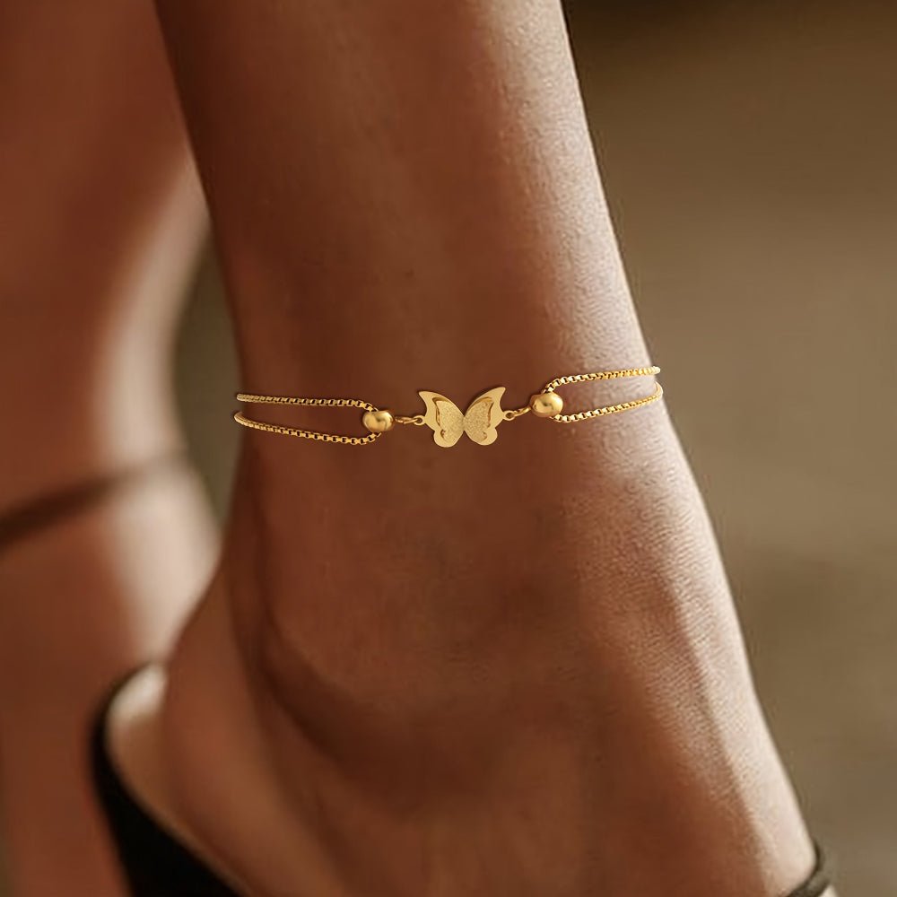 Gold butterfly charm anklet made of 18K plated stainless steel, perfect for elegant everyday wear. 1