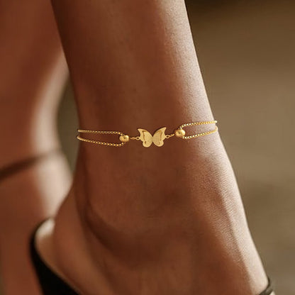 Gold butterfly charm anklet made of 18K plated stainless steel, perfect for elegant everyday wear. 1
