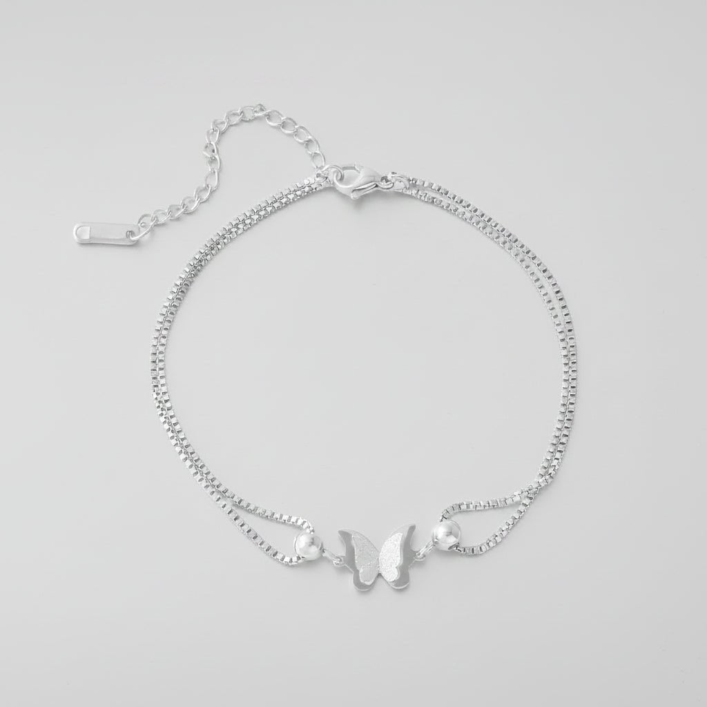 Gold butterfly charm anklet made of 18K plated stainless steel, perfect for elegant everyday wear. 3
