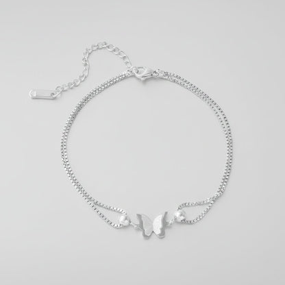 Gold butterfly charm anklet made of 18K plated stainless steel, perfect for elegant everyday wear. 3