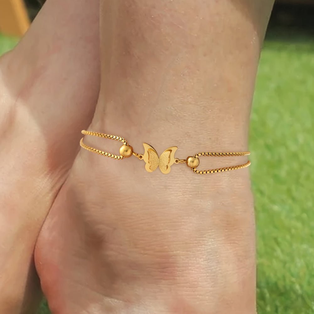Gold butterfly charm anklet made of 18K plated stainless steel, perfect for elegant everyday wear. 2