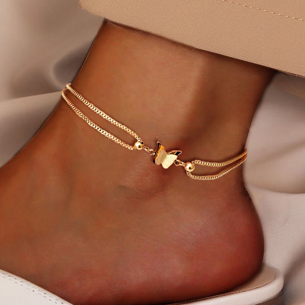 Gold butterfly charm anklet made of 18K plated stainless steel, perfect for elegant everyday wear. 0