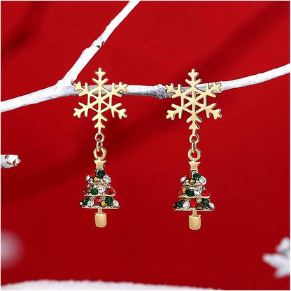 Gold dangle earrings featuring intricate snowflake and Christmas tree charms, perfect for festive holiday celebrations and seasonal fashion. 0