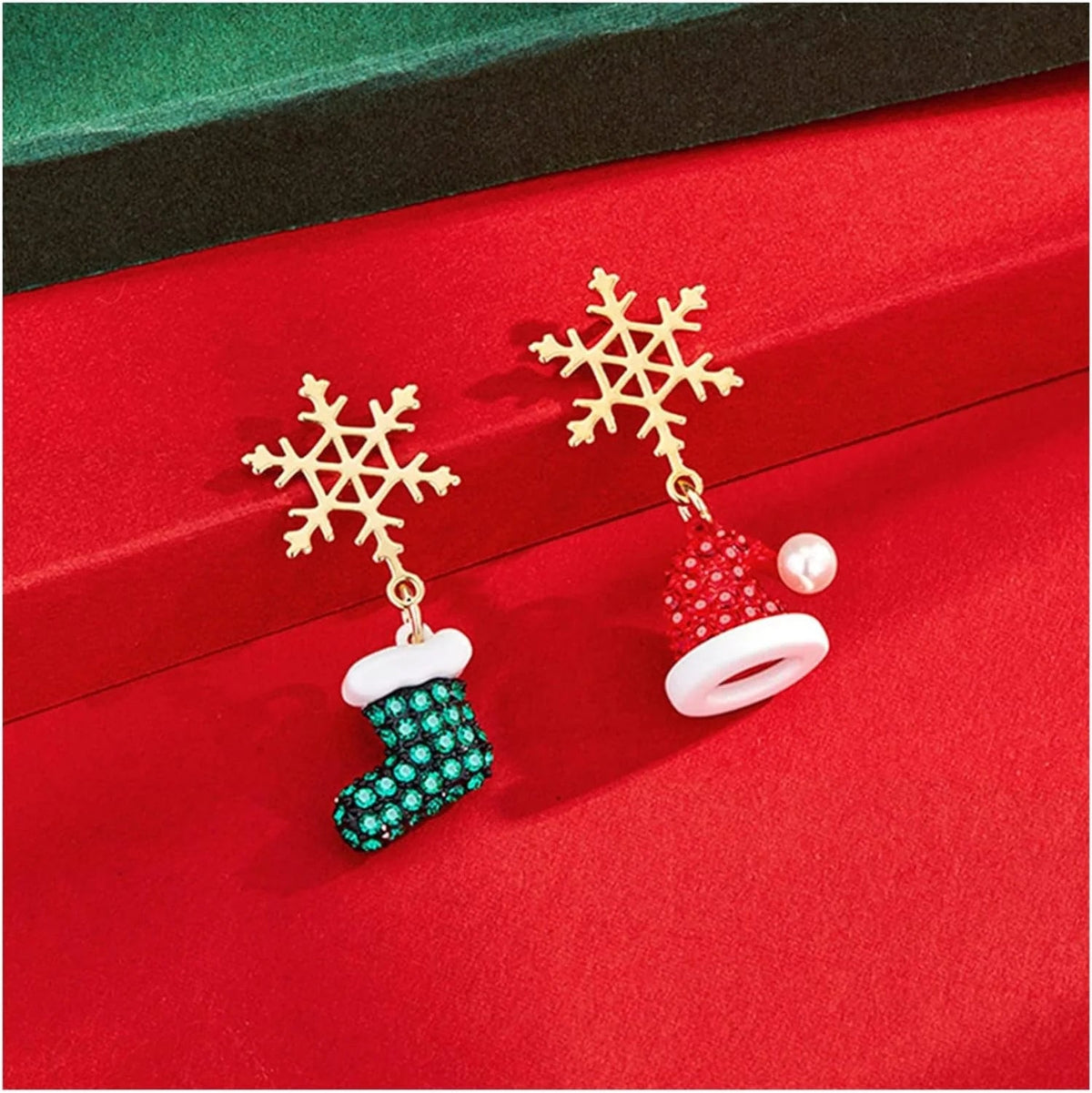 Gold dangle earrings featuring intricate snowflake and Christmas tree charms, perfect for festive holiday celebrations and seasonal fashion. 2
