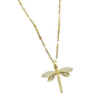 Gold dragonfly necklace featuring a sparkling crystal pendant on a 14K gold eye chain, perfect for adding an elegant touch to any outfit. 1