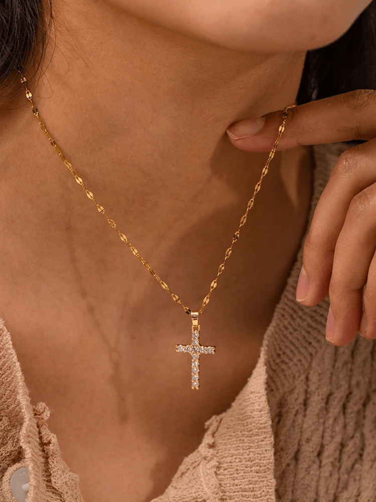 Gold-plated cross necklace featuring an adjustable chain and sparkling zircons, crafted from durable stainless steel for a stylish and spiritual accessory. 0