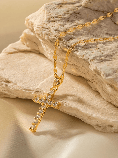 Gold-plated cross necklace featuring an adjustable chain and sparkling zircons, crafted from durable stainless steel for a stylish and spiritual accessory. 1