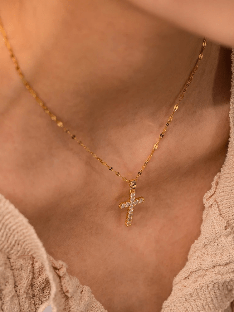 Gold-plated cross necklace featuring an adjustable chain and sparkling zircons, crafted from durable stainless steel for a stylish and spiritual accessory. 2