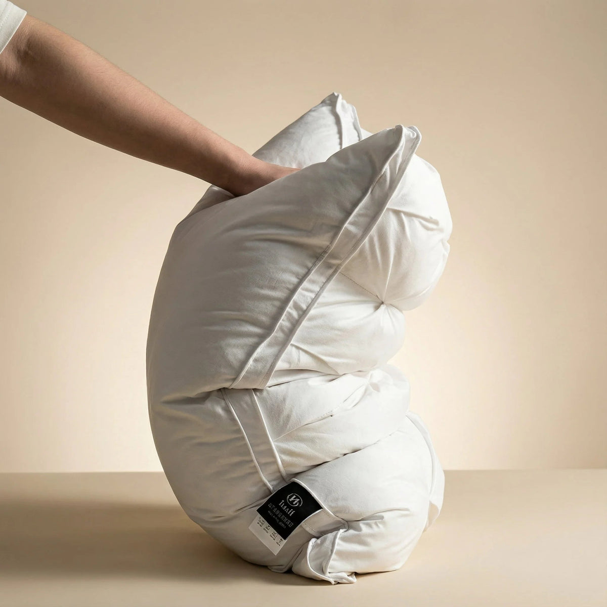 Goose down pillow with breathable cotton cover, designed for all sleep positions, offering soft support and machine washable convenience. 2
