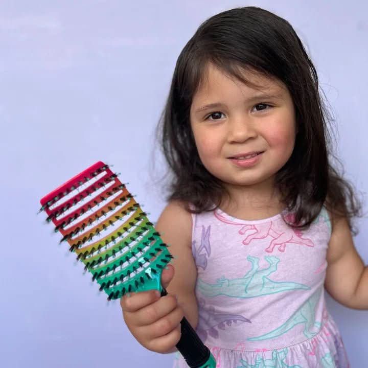 Hair brush designed for detangling with soft bristles, featuring an ergonomic design for a smooth and frizz-free finish. 7