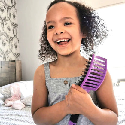 Hair brush designed for detangling with soft bristles, featuring an ergonomic design for a smooth and frizz-free finish. 3