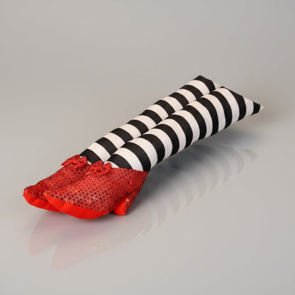 Halloween door stopper featuring whimsical witch legs with a striped design, perfect for festive indoor and outdoor decor. 4