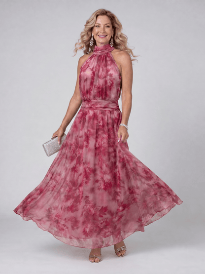 Halter neck midi dress with defined waist, made from lightweight fabric, perfect for wedding guests and summer events. 1