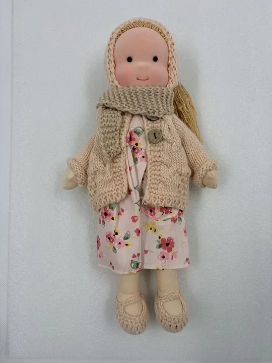Handcrafted Waldorf doll made from soft fabric and sustainable materials, featuring a washable design, perfect eco-friendly toy for kids. 2