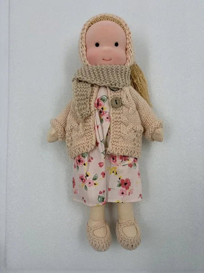 Handcrafted Waldorf doll made from soft fabric and sustainable materials, featuring a washable design, perfect eco-friendly toy for kids. 2