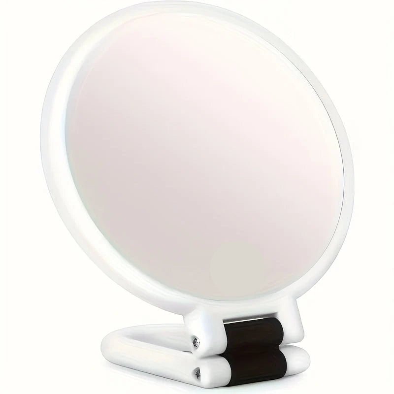 Handheld makeup mirror featuring 30X/40X magnification and a 360-degree folding handle, designed in a sleek black and white plastic finish 0