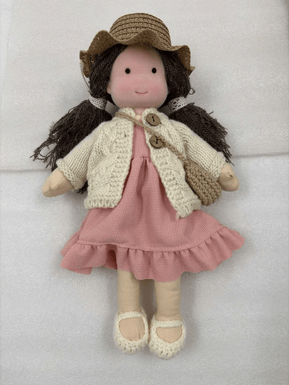 Handmade Waldorf doll featuring soft fabrics and colorful knitted clothing, measuring 28cm, designed for durability and easy cleaning, perfect for kids. 1