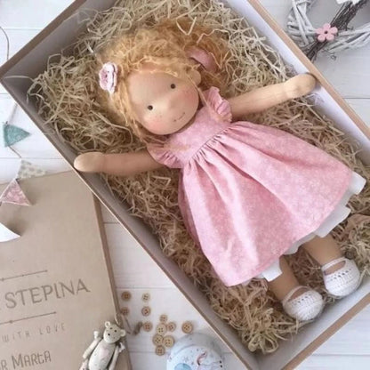 Handmade Waldorf-style doll featuring a soft cotton body and gentle design, perfect for imaginative play and nurturing creativity in children. 15