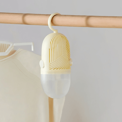 Hanging dehumidifier with reusable moisture absorber for closet, available in green, white, and yellow, designed for space-saving wardrobe organization. 2