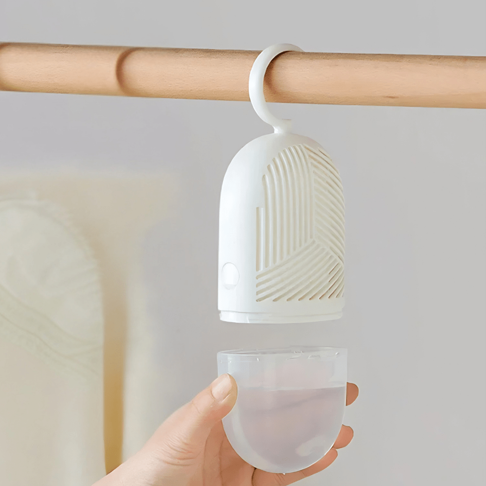 Hanging dehumidifier with reusable moisture absorber for closet, available in green, white, and yellow, designed for space-saving wardrobe organization. 1