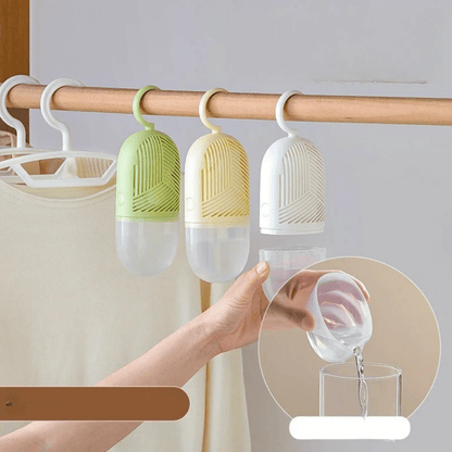 Hanging dehumidifier with reusable moisture absorber for closet, available in green, white, and yellow, designed for space-saving wardrobe organization. 5