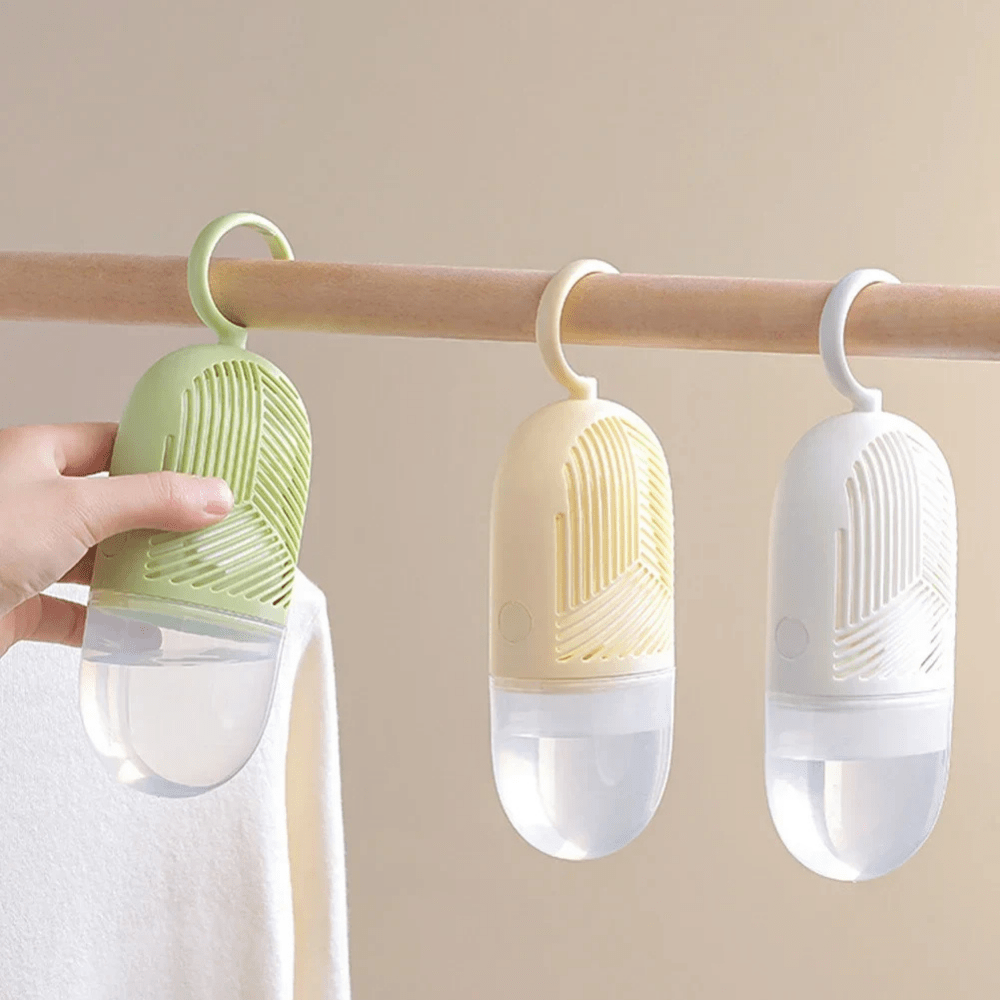 Hanging dehumidifier with reusable moisture absorber for closet, available in green, white, and yellow, designed for space-saving wardrobe organization. 3