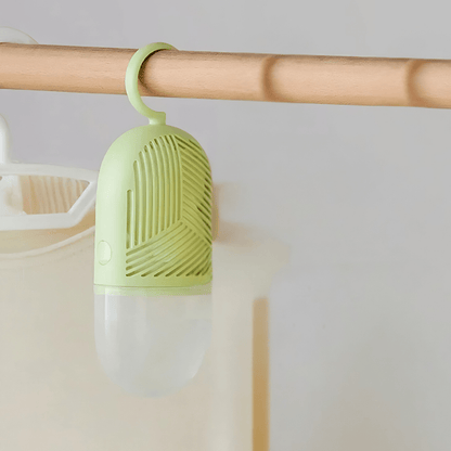 Hanging dehumidifier with reusable moisture absorber for closet, available in green, white, and yellow, designed for space-saving wardrobe organization. 0