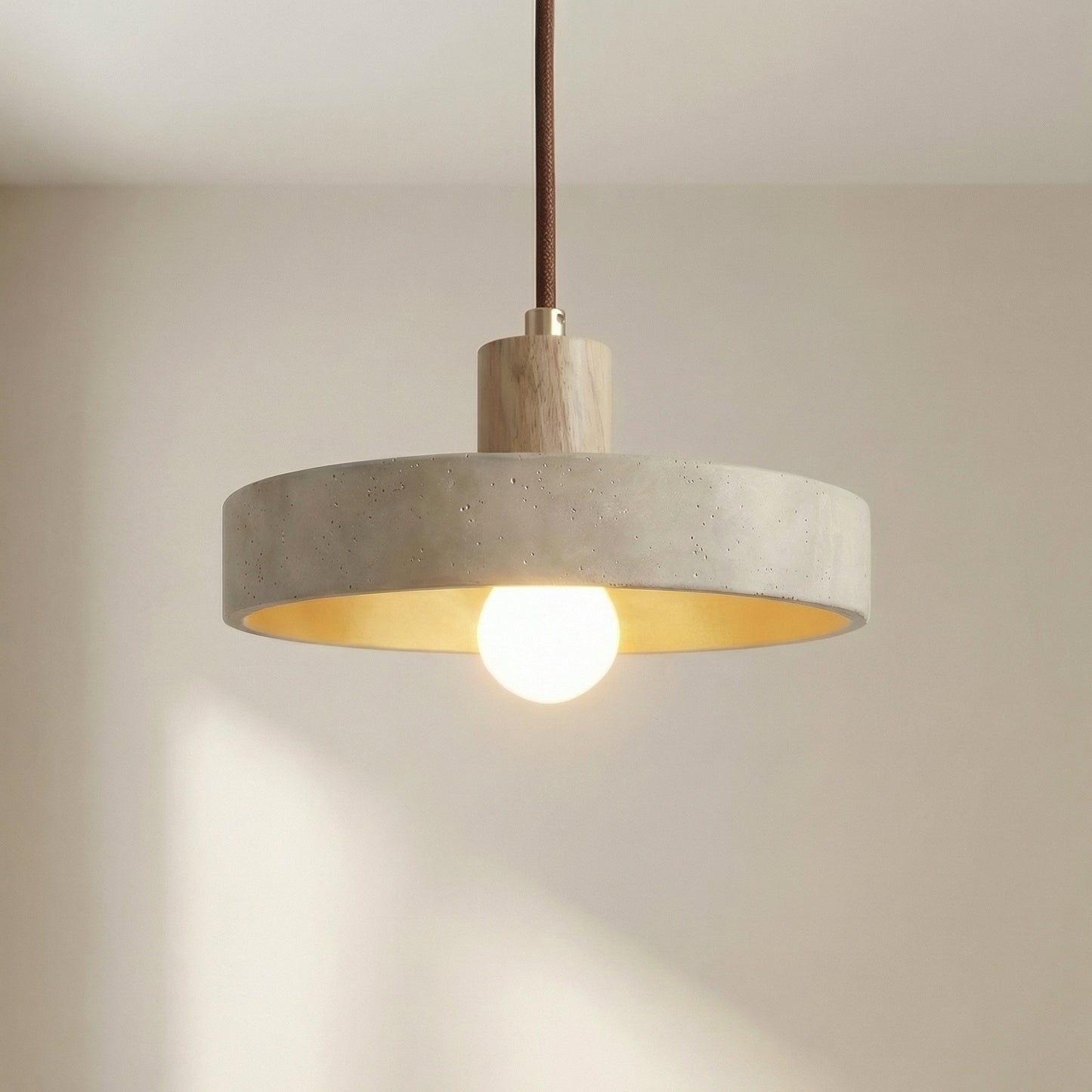 Hanging lamp with adjustable height featuring a warm LED light, designed in a Bauhaus-inspired minimalist style with a sleek travertine pendant. 0