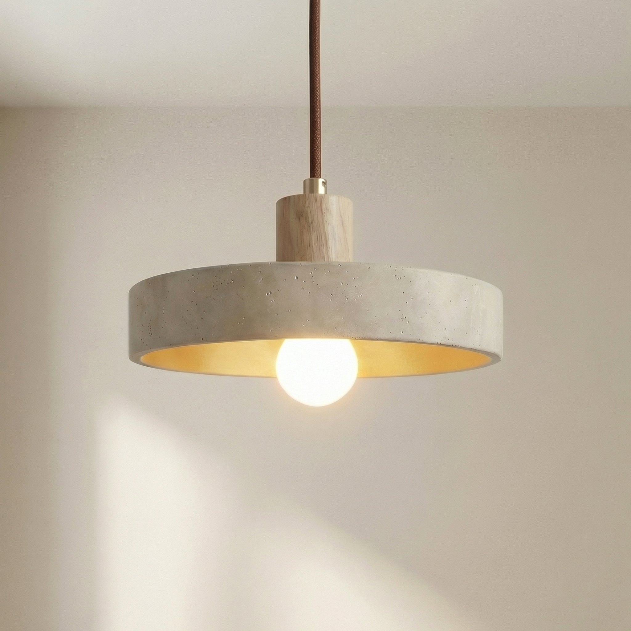 Hanging lamp with adjustable height featuring a warm LED light, designed in a Bauhaus-inspired minimalist style with a sleek travertine pendant. 0