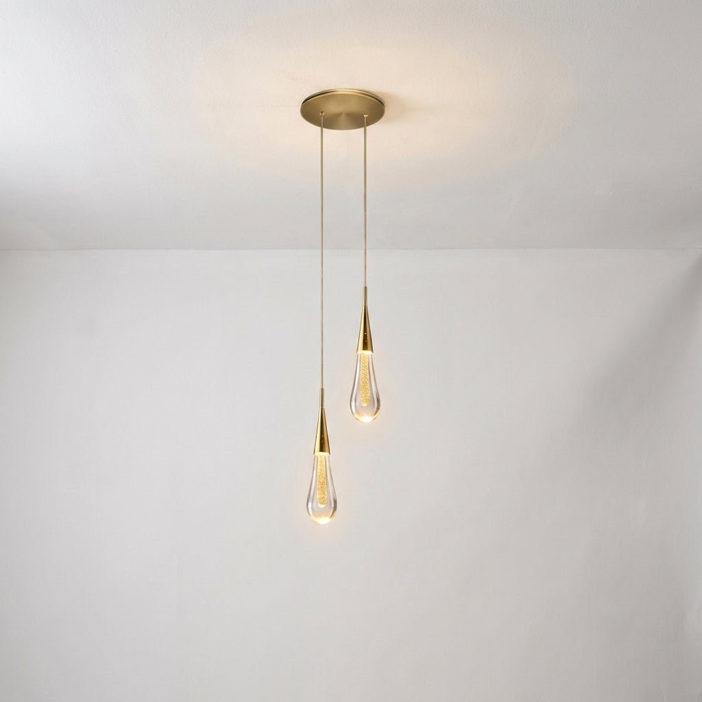 Modern kitchen pendant light featuring a stylish hanging lamp with a drop glass design, emitting warm white ambient lighting for a cozy atmosphere. 0