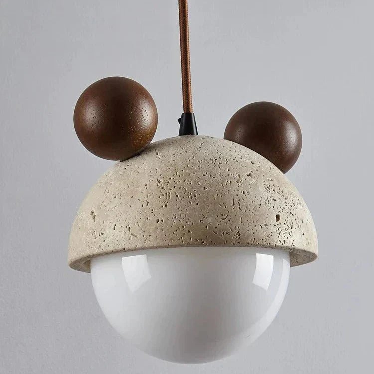 Hanging lamp featuring a warm LED light and a natural travertine finish, showcasing a playful minimalist design perfect for modern interiors. 5