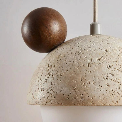 Hanging lamp featuring a warm LED light and a natural travertine finish, showcasing a playful minimalist design perfect for modern interiors. 3