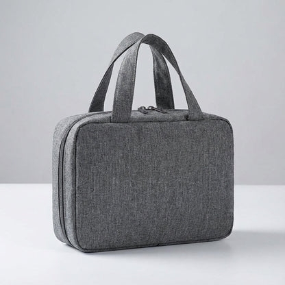 Hanging toiletry bag for women in black featuring four zippered compartments, designed as a water-repellent travel organizer for efficient packing and easy access 2