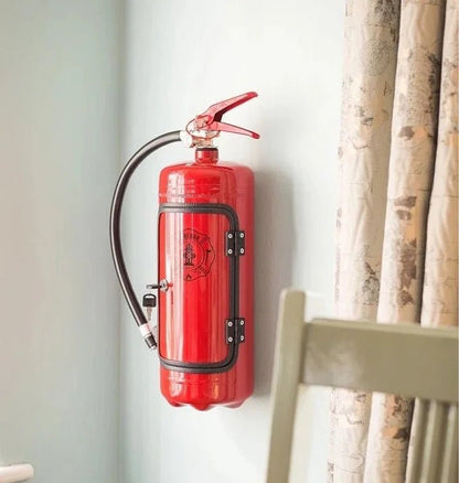 Hidden bar designed as a fire extinguisher, featuring ample storage for drinks and accessories, perfect for stylish home decor. 8